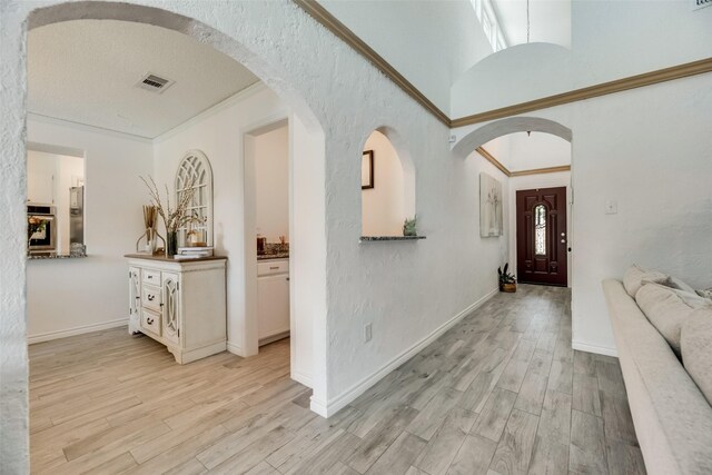 foyer entrance with light wood-type flooring