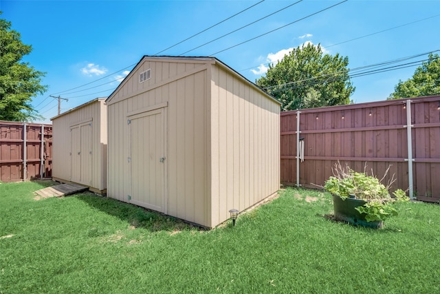 view of outbuilding with a lawn