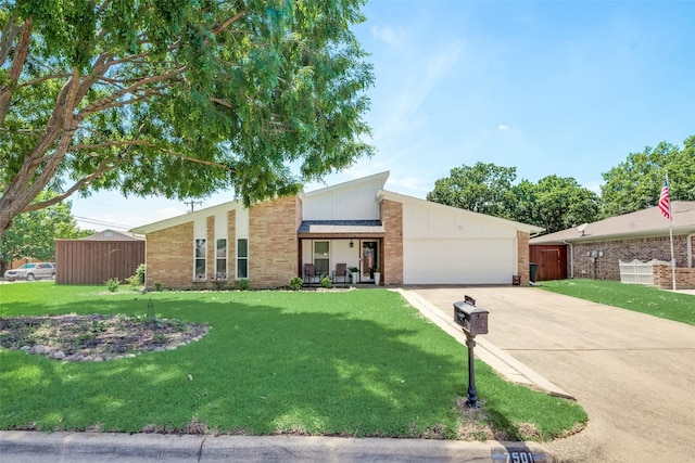 ranch-style home with a garage and a front lawn