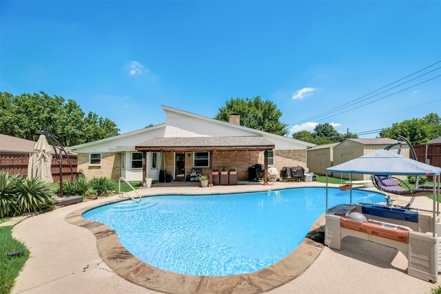 view of pool with a playground and a lawn