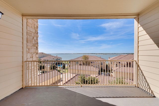 balcony featuring a water view