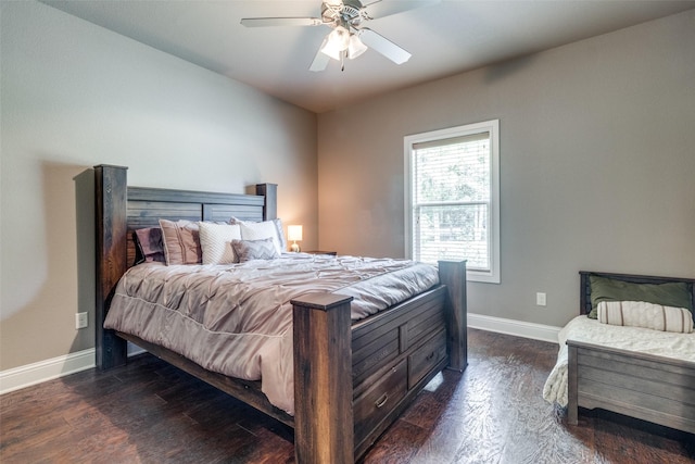 bedroom with ceiling fan and dark hardwood / wood-style flooring