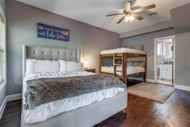 bedroom featuring ensuite bath, ceiling fan, and dark hardwood / wood-style floors