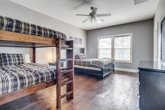 bedroom with ceiling fan and dark hardwood / wood-style floors