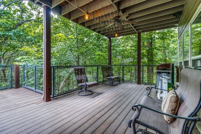 wooden deck featuring ceiling fan