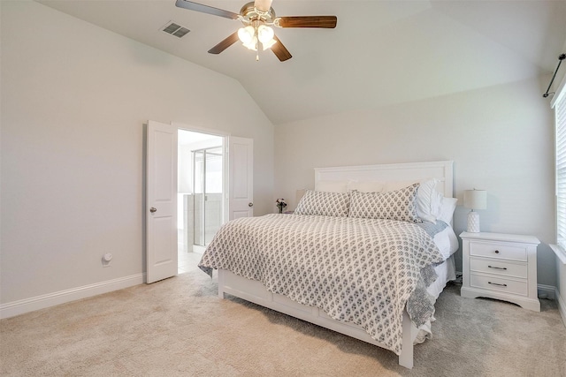 bedroom with multiple windows, vaulted ceiling, light colored carpet, and ceiling fan