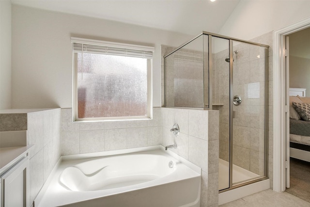 bathroom featuring lofted ceiling, tile patterned floors, and plus walk in shower