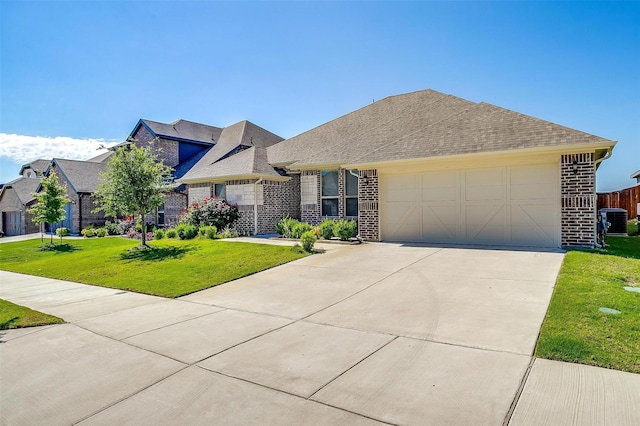 view of front facade featuring cooling unit, a garage, and a front lawn