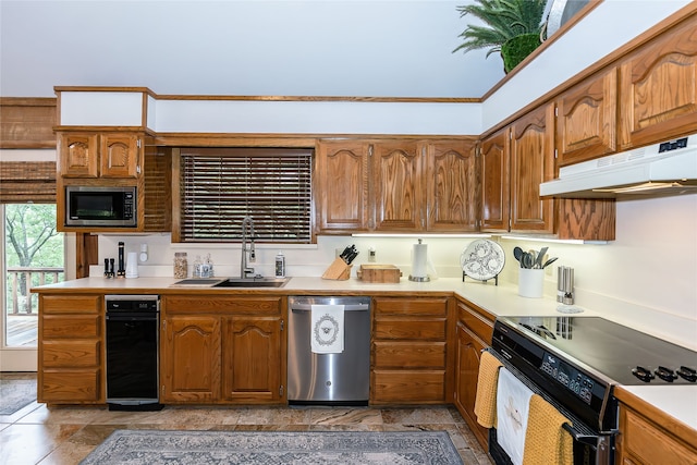 kitchen featuring appliances with stainless steel finishes, sink, tile flooring, and wine cooler