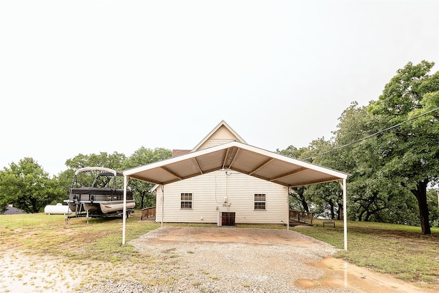 exterior space featuring central AC and a lawn