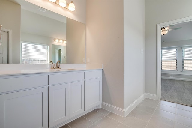 bathroom with ceiling fan, tile patterned flooring, and vanity