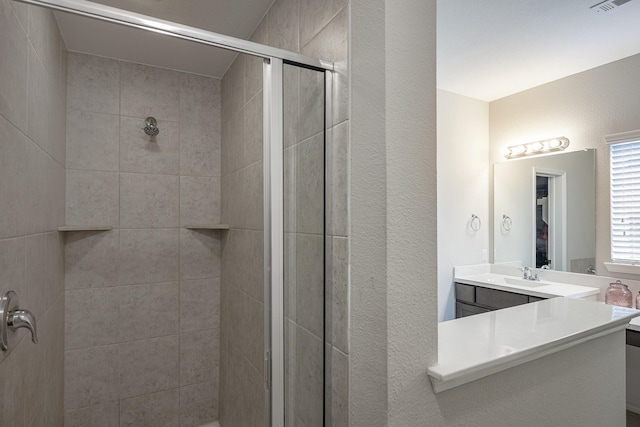 bathroom featuring vanity and walk in shower