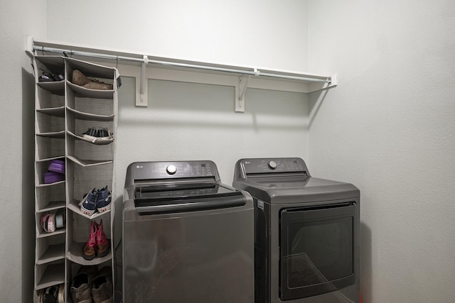 laundry area with independent washer and dryer