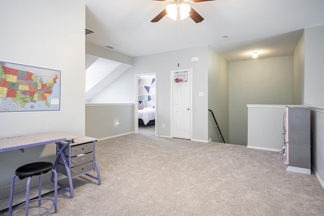 office space with light carpet and ceiling fan