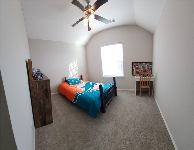 carpeted bedroom with ceiling fan and vaulted ceiling