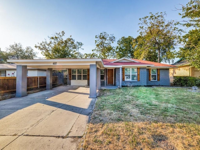 single story home with a carport and a front yard