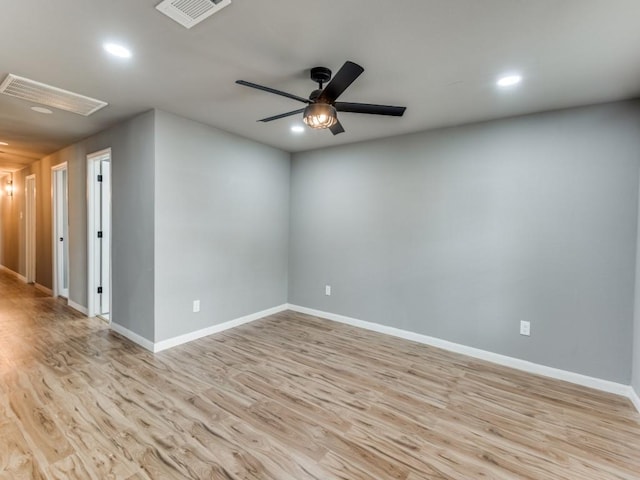 empty room with light hardwood / wood-style floors and ceiling fan