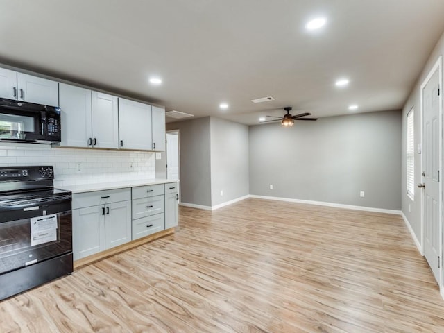 kitchen featuring white cabinetry, ceiling fan, tasteful backsplash, light hardwood / wood-style flooring, and black appliances