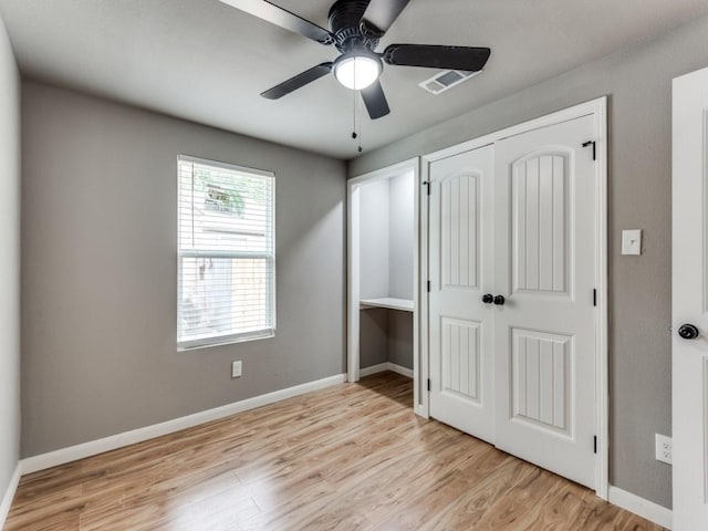 unfurnished bedroom with ceiling fan and light hardwood / wood-style floors