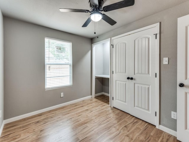 unfurnished bedroom featuring a closet, ceiling fan, and light hardwood / wood-style flooring