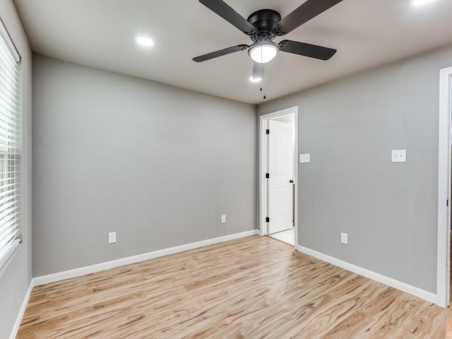 unfurnished room featuring ceiling fan and light hardwood / wood-style floors