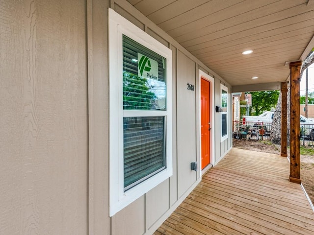 wooden terrace with a porch