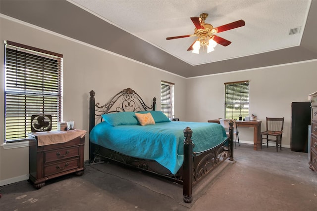 bedroom with crown molding, ceiling fan, a raised ceiling, and a textured ceiling