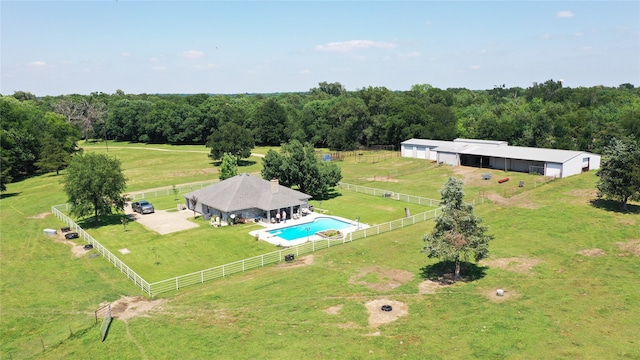 birds eye view of property with a rural view