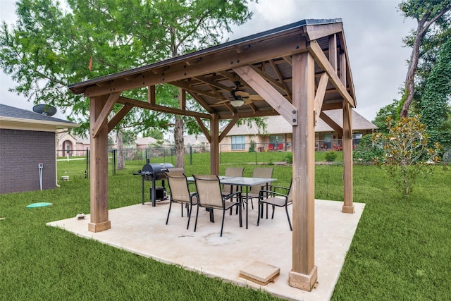 view of patio / terrace featuring a gazebo, grilling area, and ceiling fan