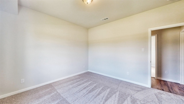 empty room with dark carpet