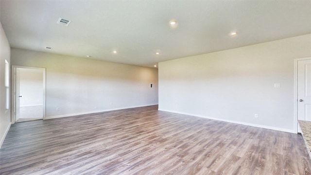 spare room with light hardwood / wood-style flooring