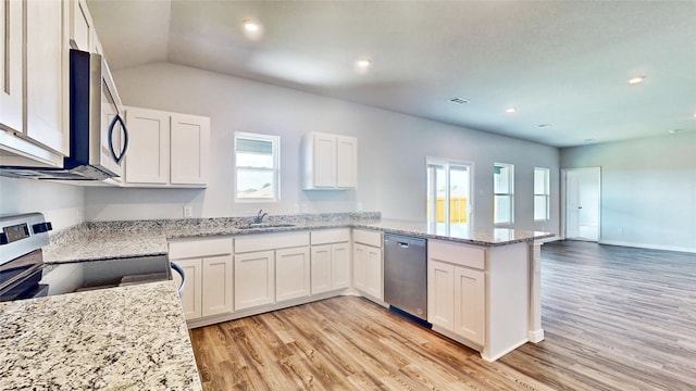 kitchen with light hardwood / wood-style flooring, stainless steel appliances, and white cabinets