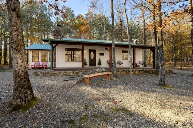 view of front of house featuring ceiling fan and covered porch