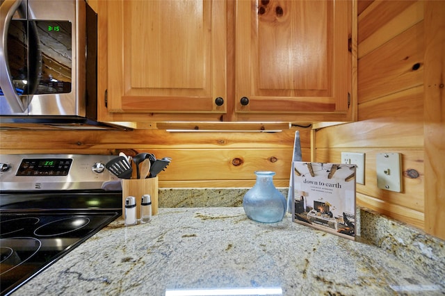 interior details with light stone counters and stainless steel appliances