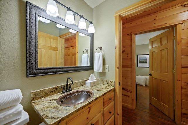 bathroom featuring vanity and hardwood / wood-style flooring