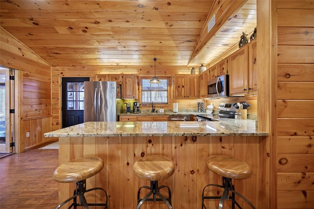 kitchen featuring sink, wooden ceiling, kitchen peninsula, vaulted ceiling, and appliances with stainless steel finishes