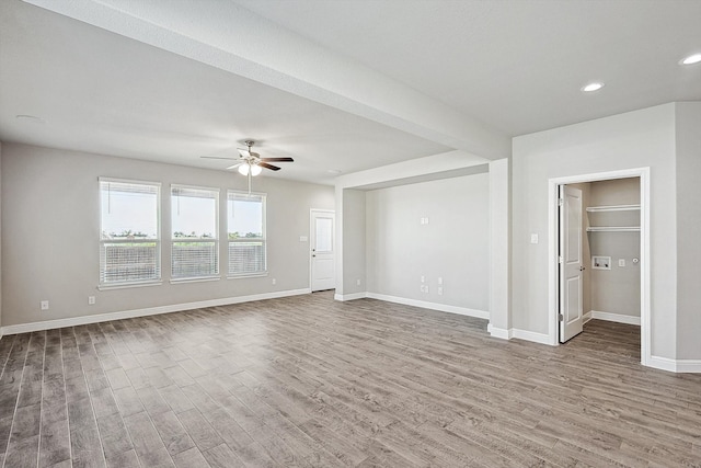 interior space featuring hardwood / wood-style floors and ceiling fan