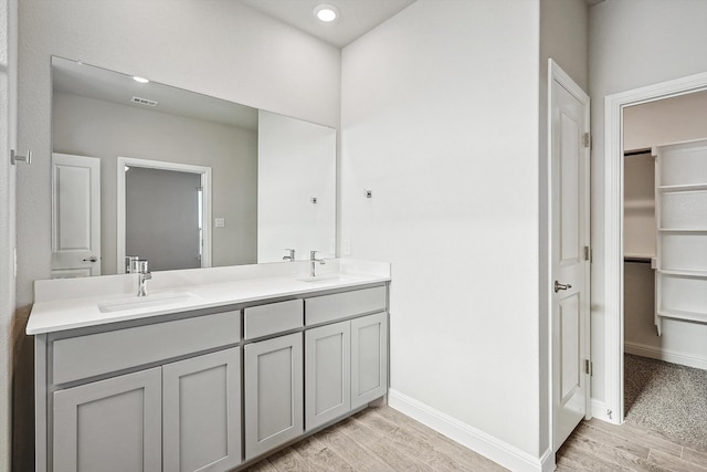 bathroom featuring vanity and hardwood / wood-style floors