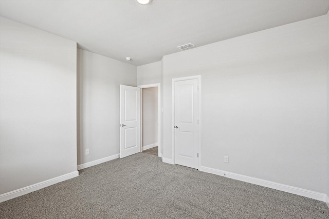 spare room featuring carpet flooring