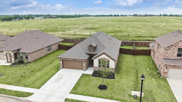 birds eye view of property featuring a rural view