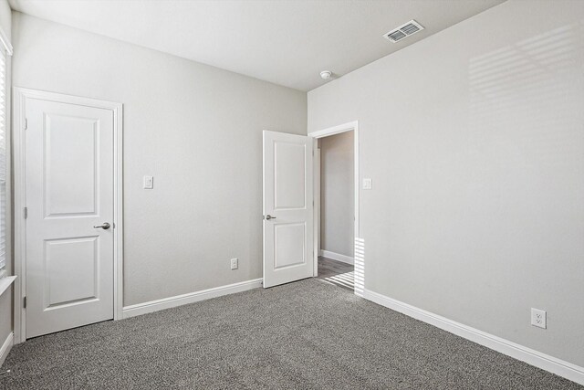 full bathroom featuring vanity, tiled shower / bath combo, wood-type flooring, and toilet