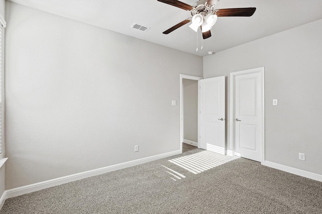 unfurnished bedroom with carpet floors and ceiling fan