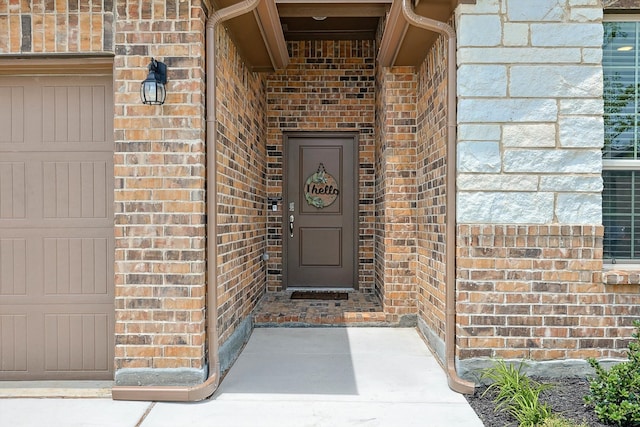 doorway to property featuring a garage