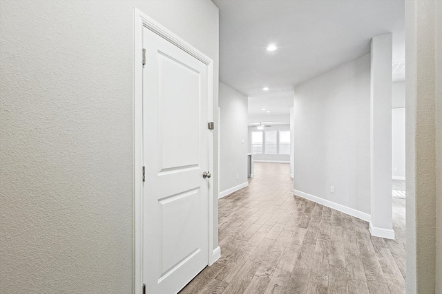 hall with light wood-type flooring