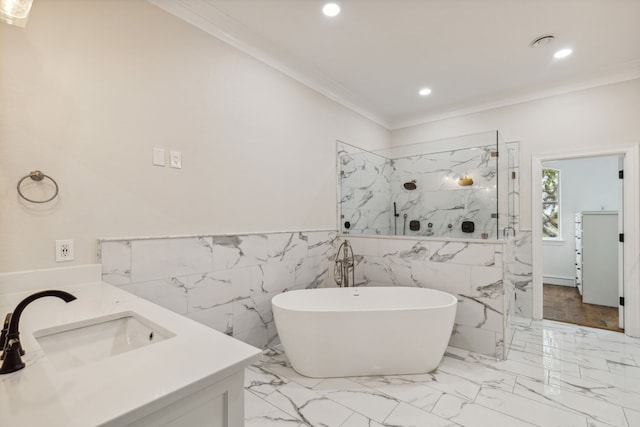 bathroom with crown molding, vanity, tile walls, and shower with separate bathtub