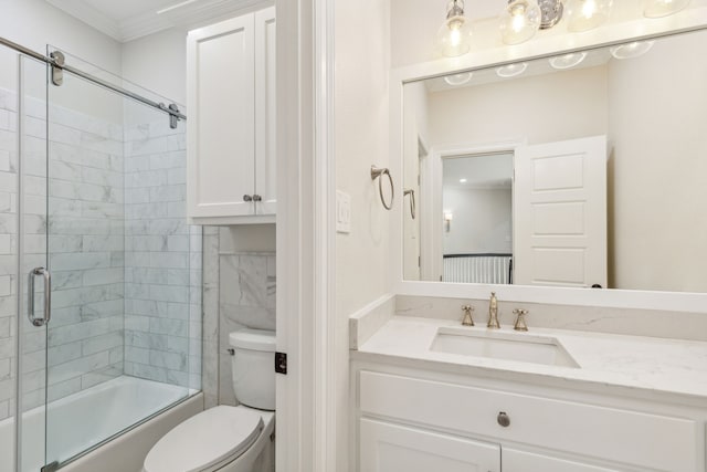 full bathroom with vanity, toilet, shower / bath combination with glass door, and crown molding