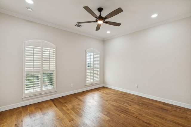 spare room with wood-type flooring, ceiling fan, and ornamental molding