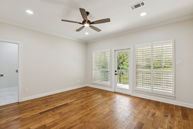 unfurnished room with wood-type flooring, ceiling fan, and crown molding