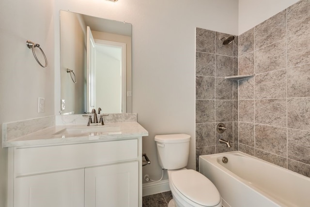 full bathroom featuring tiled shower / bath combo, vanity, and toilet