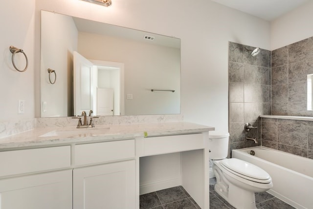 full bathroom featuring vanity, toilet, tile patterned flooring, and shower / washtub combination